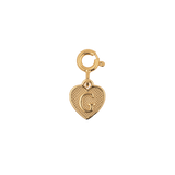 Gold heart charm with engraved letter 'G', symbolizing love and personal connections.