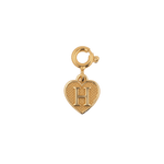 Gold heart charm pendant with letter 'H', symbolizing love and personal connection.