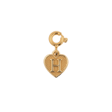 Gold heart charm pendant with letter 'H', symbolizing love and personal connection.