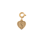 Gold heart charm pendant engraved with the letter N, representing love and personal connections.