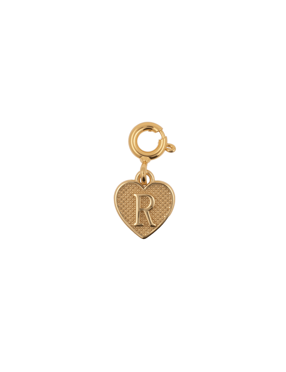 Elegant gold heart charm with letter 'R', symbolizing love and cherished memories.