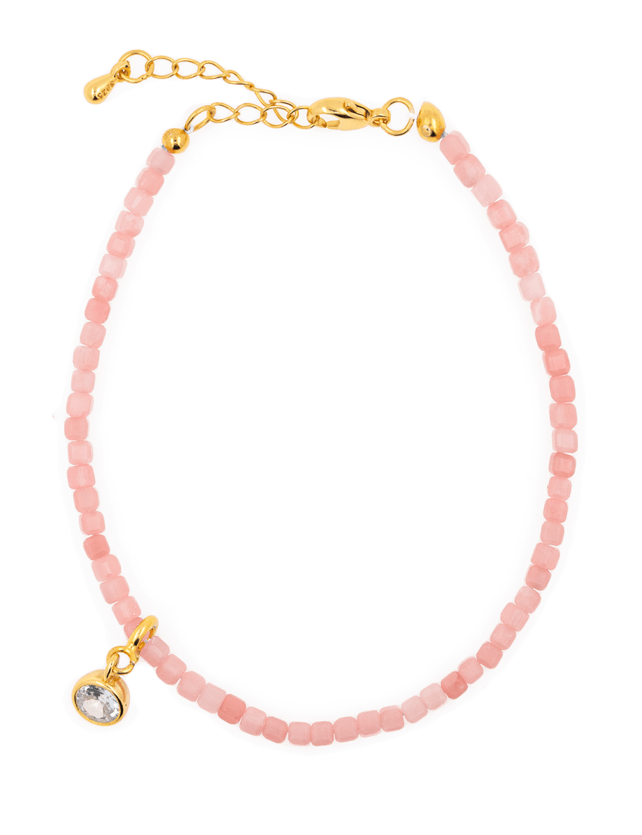 Love Pink Opal bracelet with Clear Zircon charm on a gold clasp, symbolizing clarity and emotional healing.