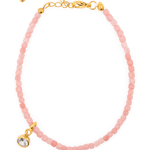 Love Pink Opal bracelet with Clear Zircon charm on a gold clasp, symbolizing clarity and emotional healing.