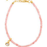 Love Pink Opal bracelet with Clear Zircon charm on a gold clasp, symbolizing clarity and emotional healing.