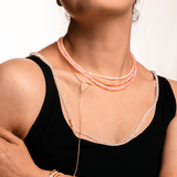 Model wearing a Love Pink Opal Faceted Necklace showcasing its dainty design and soft rosy glow.