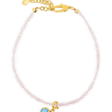 Rose Quartz faceted bracelet with Blue Zircon charm and gold clasp for emotional harmony and self-love.