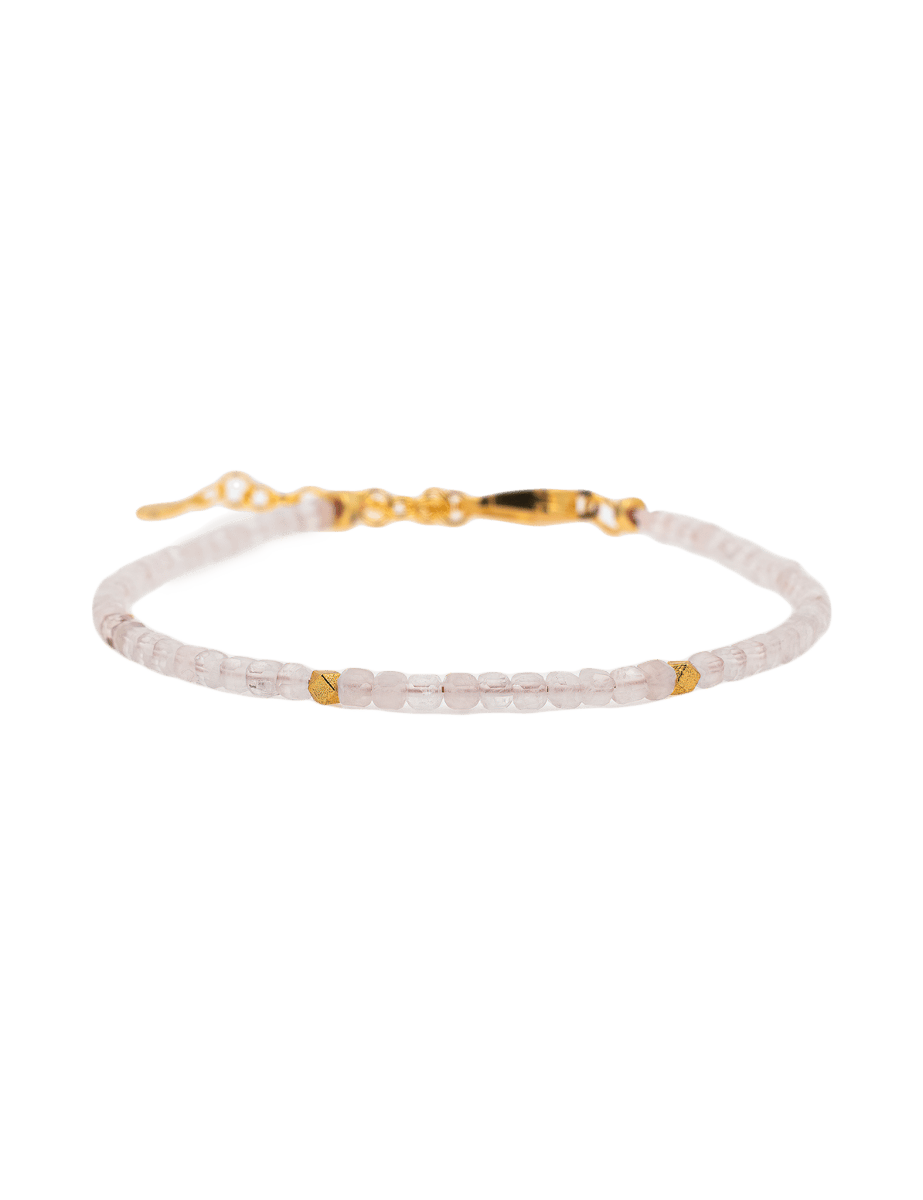 Love rose quartz faceted bracelet with gold spacer beads for emotional healing and self-love.