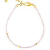 Love Rose Quartz bracelet with silver spacer beads, promoting emotional healing and self-love.