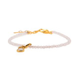 Delicate Rose Quartz bracelet with Hulu charm and 925 sterling silver clasp, promoting love and emotional balance.