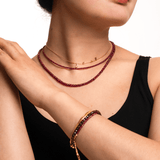 Model showcasing Love Ruby Faceted Dainty Necklace and bracelet, radiating warmth and elegance.