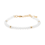 Dainty bracelet featuring clear quartz beads and gold spacer beads, symbolizing clarity and resilience.