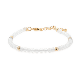 Dainty bracelet featuring clear quartz beads and gold spacer beads, symbolizing clarity and resilience.