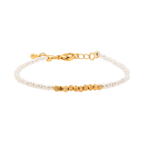 Metal Lunar Essence Pearl Dainty Bracelet with silver spacer beads and natural pearls, showcasing elegance and simplicity.