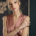 Model showcasing the Lunar Essence Pearl Dainty Bracelet with silver spacer beads, exuding elegance and sophistication.