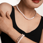 Model wearing New York Moonstone & Conch Shell faceted necklace and matching bracelet, showcasing serene oceanic elegance.