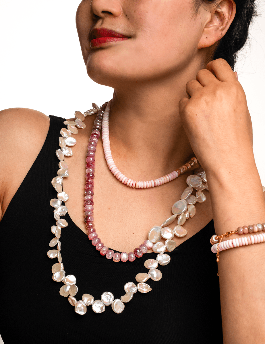 Model wearing New York Moonstone & Conch Shell Faceted Necklace, showcasing ocean-inspired elegance and tranquility.