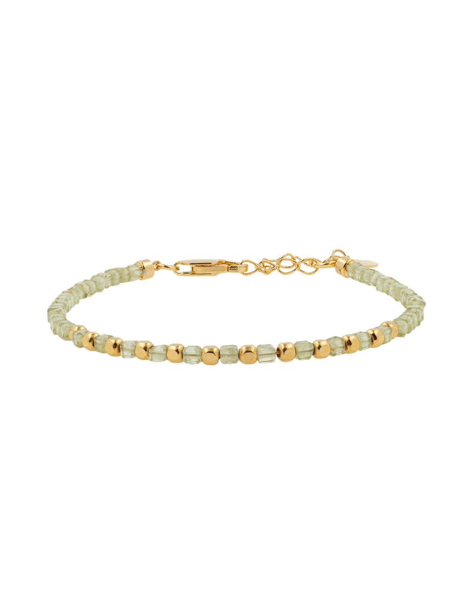 Dainty peridot bracelet with faceted beads and gold-plated sterling silver accents, perfect for layering.