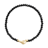 Black Onyx bracelet with 3x4mm faceted beads and a gold clasp, promoting protection and emotional balance.