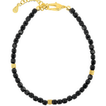 Black Tourmaline faceted bracelet with gold spacer beads, enhancing protection and emotional stability.
