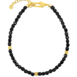 Black Tourmaline faceted bracelet with gold spacer beads, enhancing protection and emotional stability.