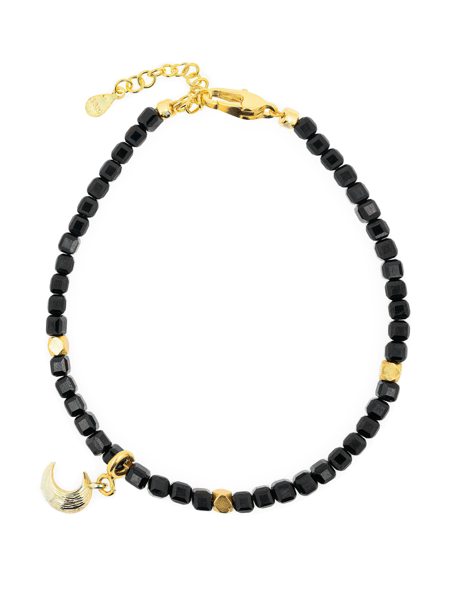Black Tourmaline faceted bracelet with gold spacer beads and moon charm for energy protection.