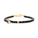 Black Tourmaline faceted bracelet with silver spacer bead and moon charm for protection and emotional balance.