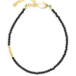 Black Tourmaline faceted bracelet with gold clasp and silver spacer, promoting protection and emotional stability.