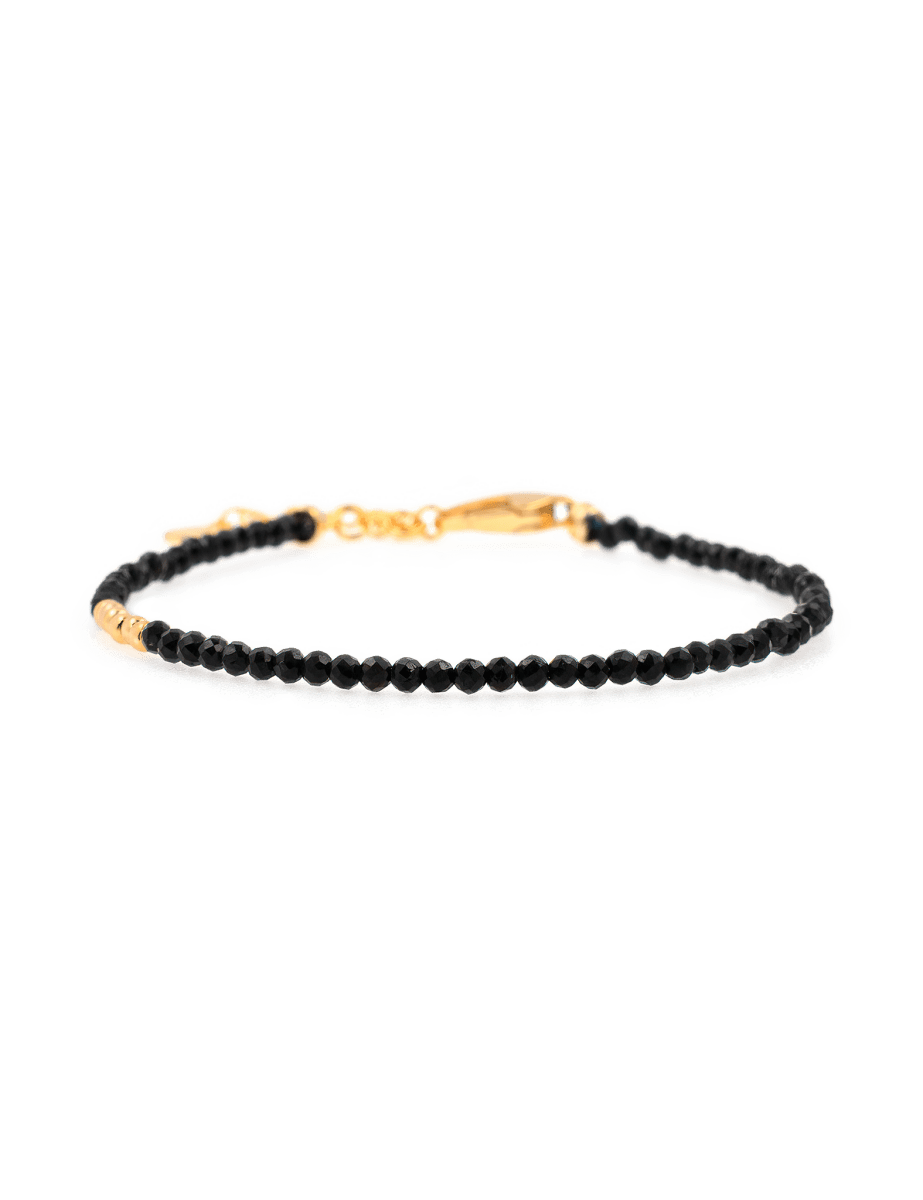 Black Tourmaline faceted dainty bracelet with silver spacer bead, promoting protection and emotional stability.