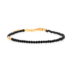 Black Tourmaline faceted dainty bracelet with silver spacer bead, promoting protection and emotional stability.
