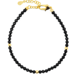 Dainty Black Tourmaline bracelet with gold spacer beads, featuring a secure clasp for elegant protection and grounding.