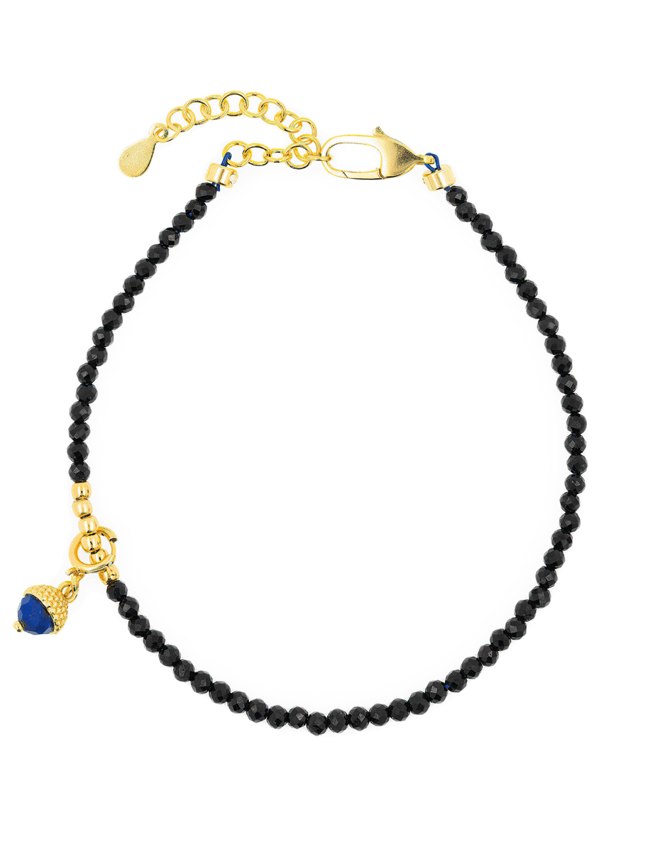 Black Tourmaline bracelet with silver spacer and Lapis Lazuli charm, elegant protective jewelry piece.