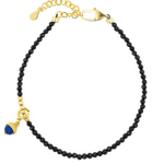 Black Tourmaline bracelet with silver spacer and Lapis Lazuli charm, elegant protective jewelry piece.