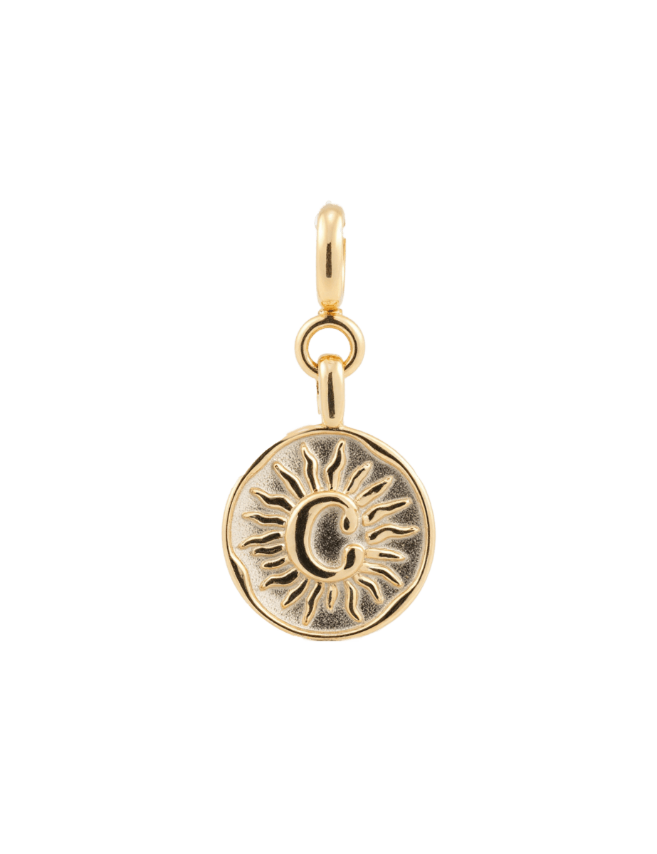 Gold round sun charm with 'C' engraving symbolizing protection and vitality, made from 925 sterling silver.