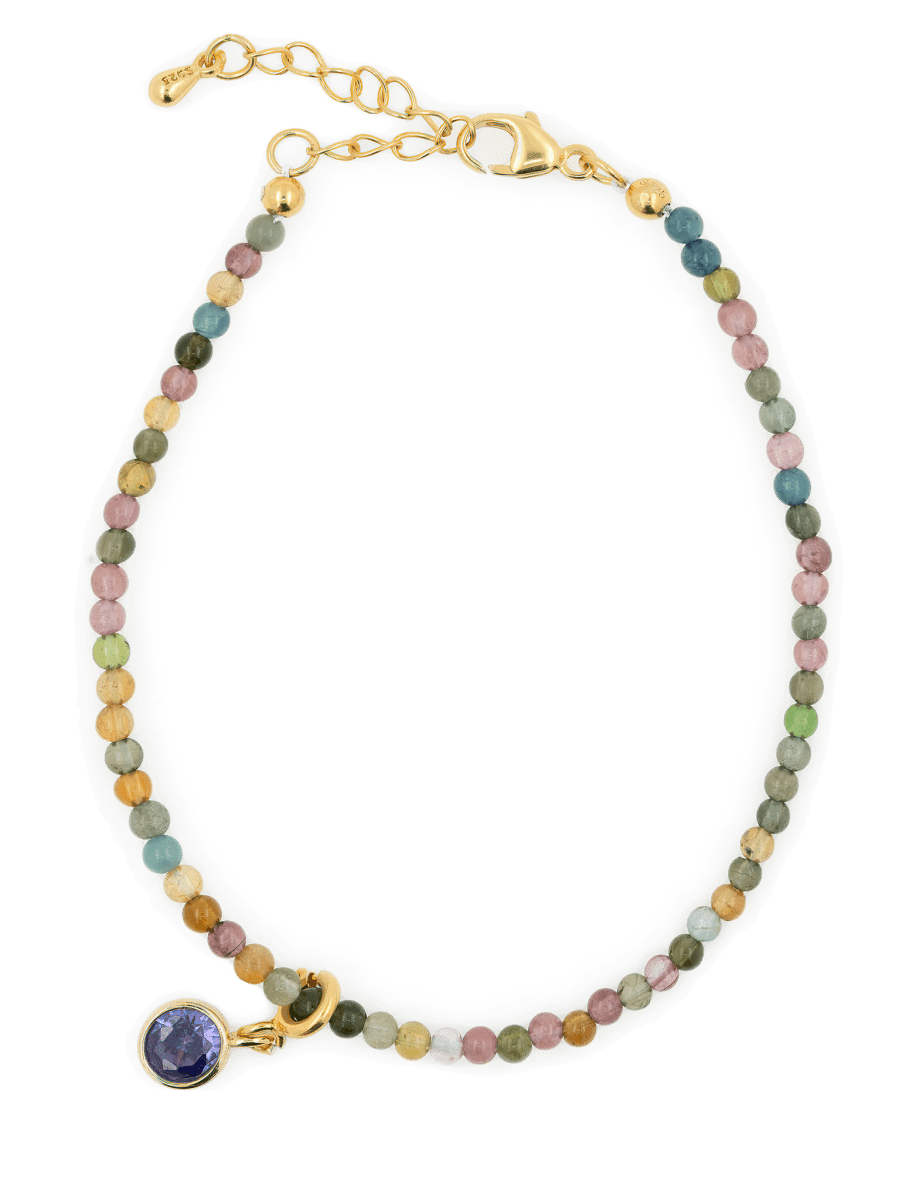Protection Tourmaline bracelet with purple zircon charm, symbolizing emotional healing and spiritual growth.