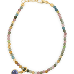 Protection Tourmaline bracelet with purple zircon charm, symbolizing emotional healing and spiritual growth.