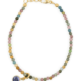 Protection Tourmaline bracelet with purple zircon charm, symbolizing emotional healing and spiritual growth.
