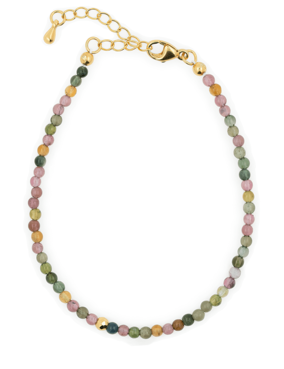 Tourmaline dainty bracelet with gold clasp and spacer beads for protection and positivity.