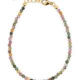 Tourmaline dainty bracelet with gold clasp and spacer beads for protection and positivity.