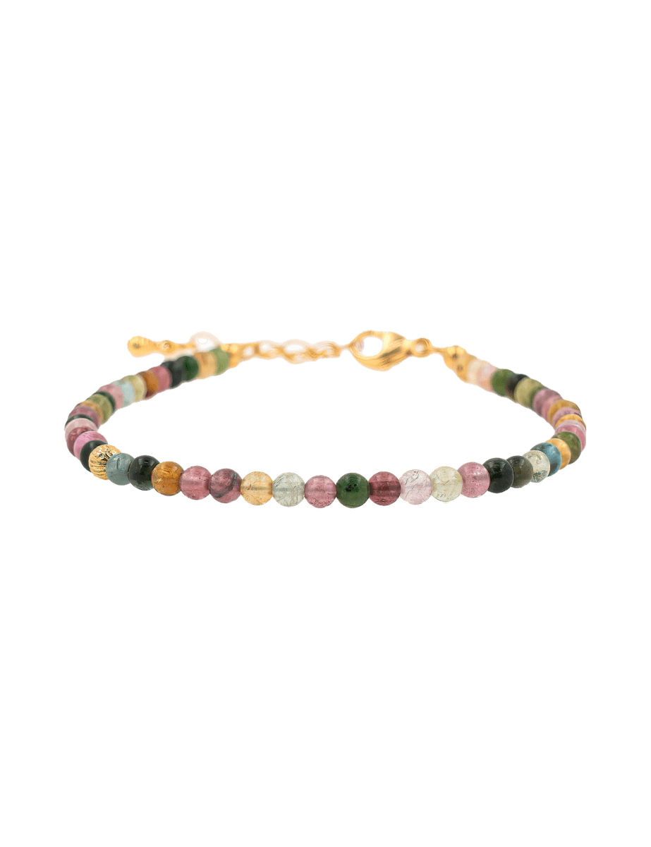 Dainty tourmaline bracelet with silver spacer beads, enhancing energy protection and style.