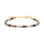 Dainty tourmaline bracelet with silver spacer beads, enhancing energy protection and style.