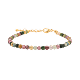 Dainty tourmaline bracelet with silver spacer beads, enhancing energy protection and style.
