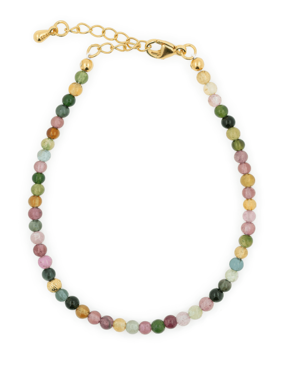 Dainty protection tourmaline bracelet with silver spacer beads, designed to absorb negative energy and enhance elegance.