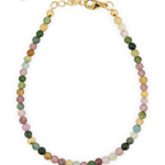 Dainty protection tourmaline bracelet with silver spacer beads, designed to absorb negative energy and enhance elegance.