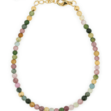 Dainty protection tourmaline bracelet with silver spacer beads, designed to absorb negative energy and enhance elegance.