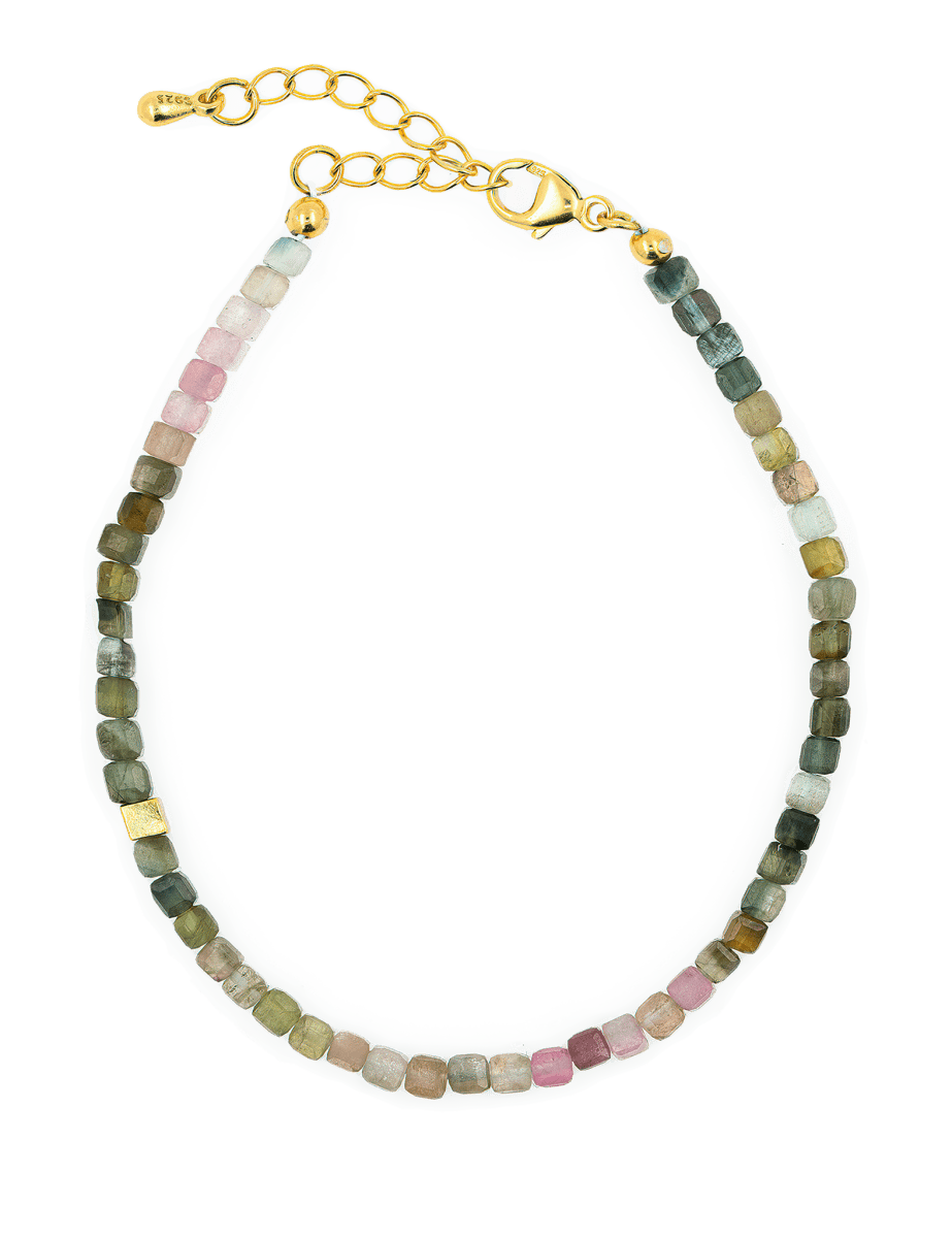Dainty tourmaline bracelet with silver spacer beads, designed for protection and emotional stability.