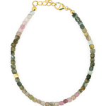 Dainty tourmaline bracelet with silver spacer beads, designed for protection and emotional stability.