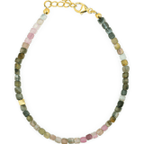 Dainty tourmaline bracelet with silver spacer beads, designed for protection and emotional stability.