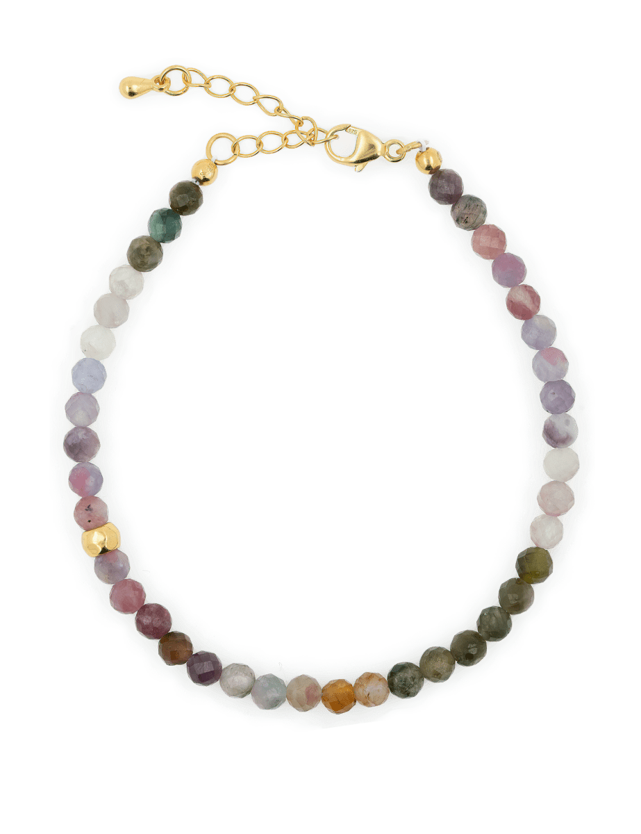Dainty tourmaline bracelet with silver spacers, offering protection and grounding against negative energy.