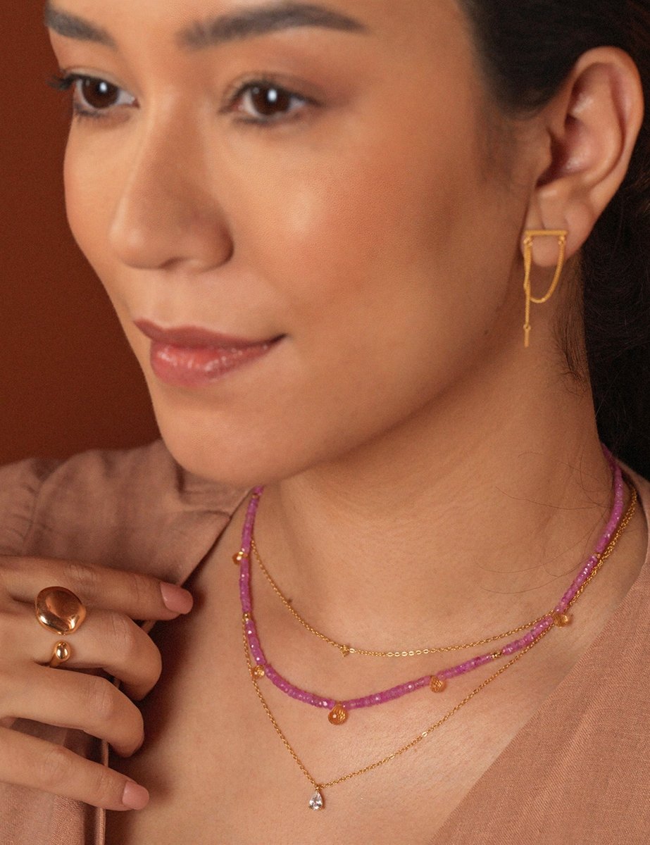 Model wearing BEAMMORE pink sapphire and citrine 18K gold necklace – Elegant birthstone jewelry gift for women