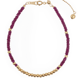 SHANGHAI Ruby Beaded Bracelet featuring gold accents, adjustable length, handcrafted with passion and vitality.